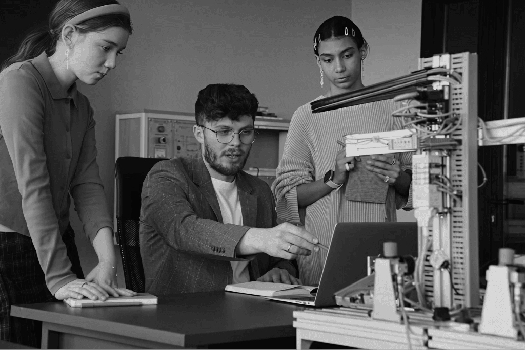 Engineers reviewing robotics hardware in a lab