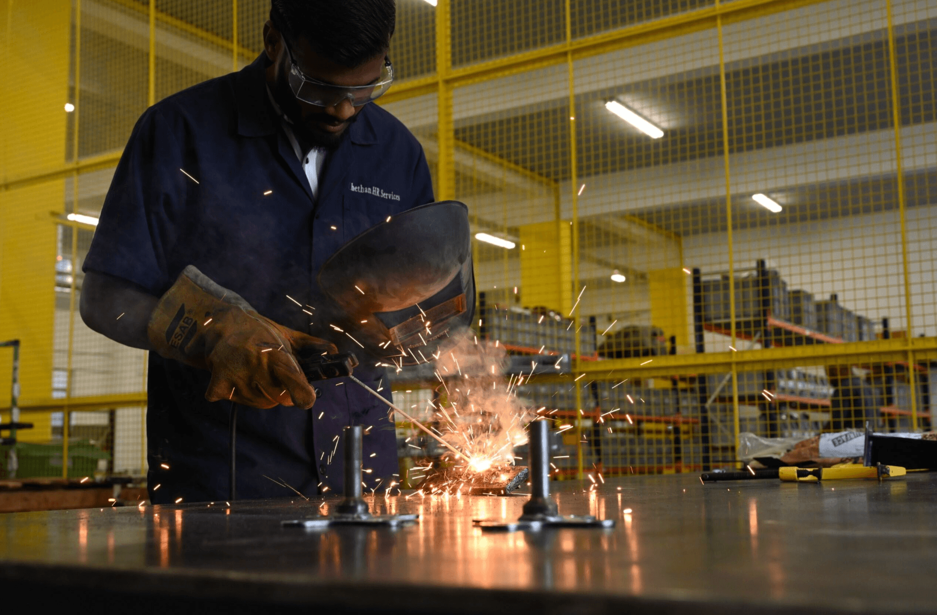 Virya engineer working on precision manufacturing equipment