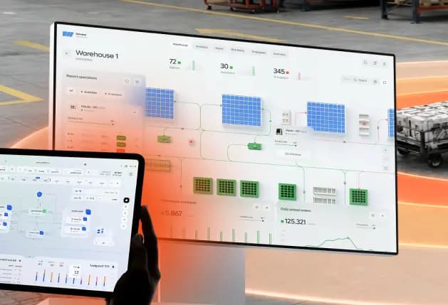 Fleet management dashboard shown on a wall monitor and tablet in a warehouse