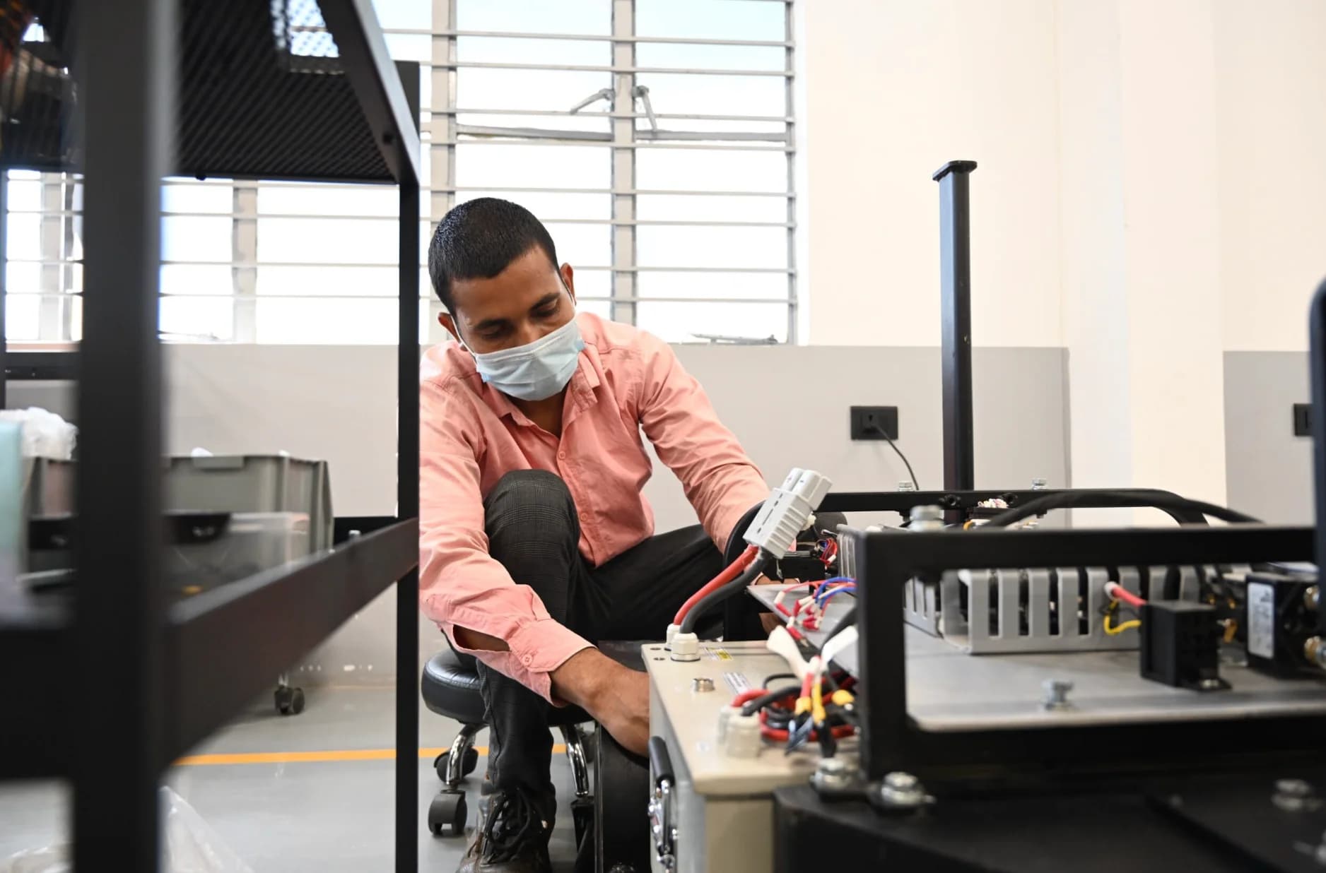 Engineer testing hardware in the lab